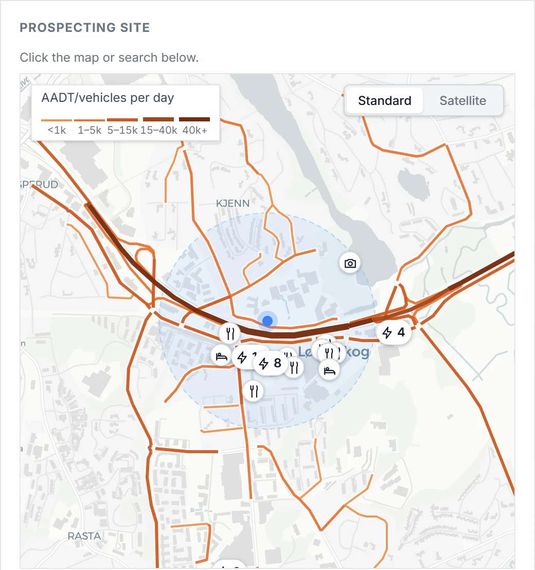 A candidate site near Oslo on the map, with traffic on nearby roads, existing fast chargers, restaurants and hotels